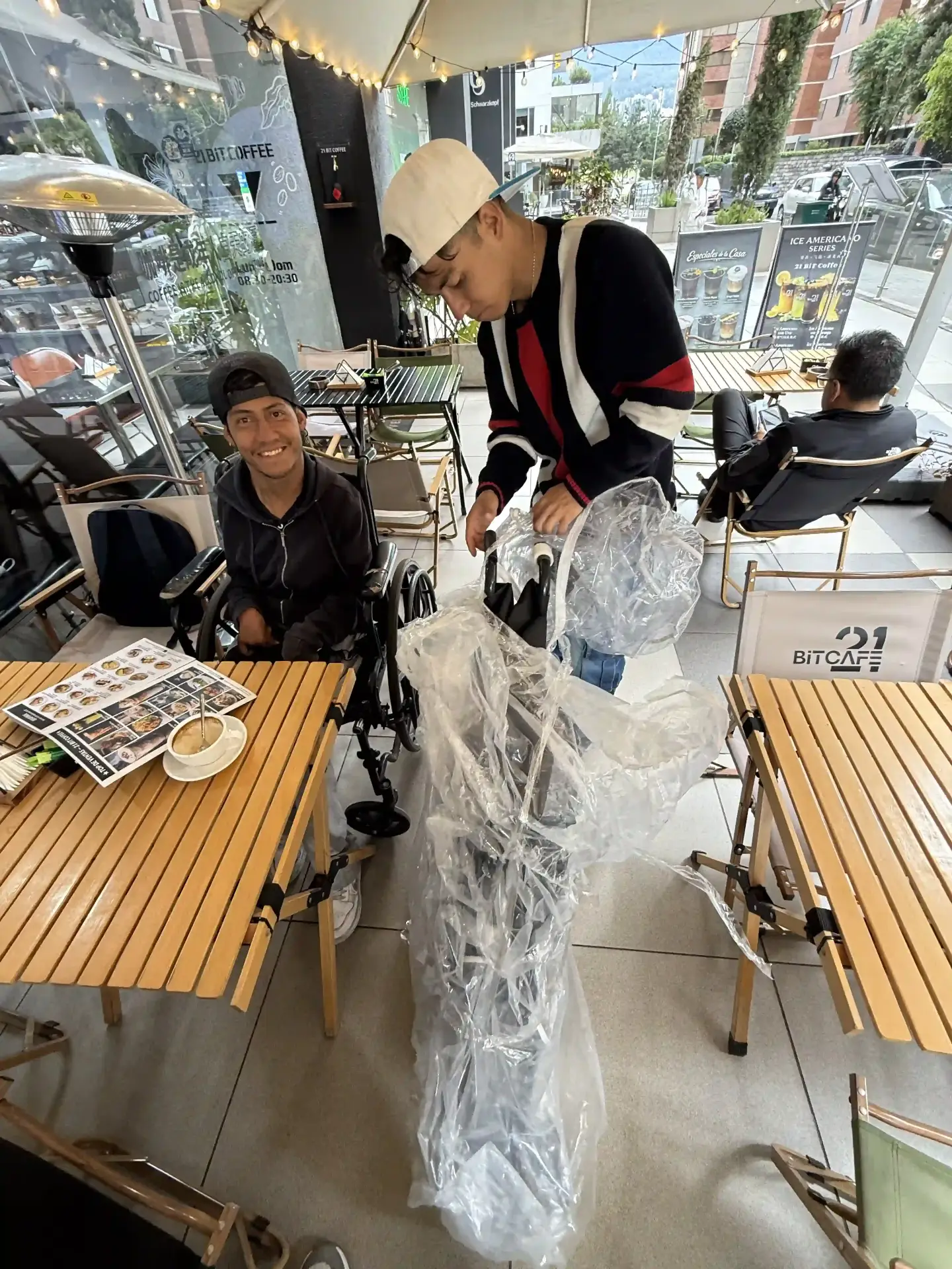 Angel receiving his new wheelchair